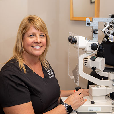 EV5A9892 Dr. Dragoo in scrubs at eye exam equipment